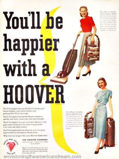 proud housewife with her new vacuum cleaner